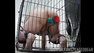 Caged Slave takes order from Sir to ride his dildo