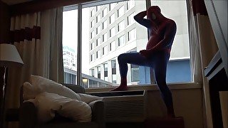 spiderman shows his hard cock to office workers from his hotel room