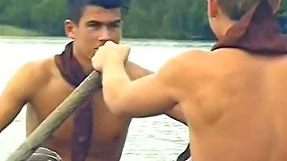 Hot boys rowing in a boat and sucking