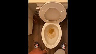 POV young male peeing in the toilet