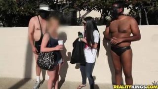 Racy brunette huzzy is sucking penis in public place