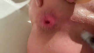 Anal toying in the tub