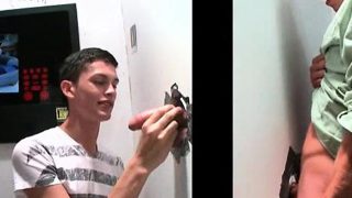 Slim gay proving cock blowing skills on gloryhole