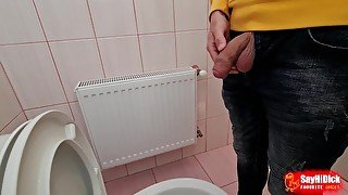 Uncircumcised cock pees on the station toilet