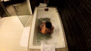 Jezebelle Bond films herself taking a bath