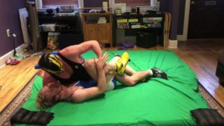 Tall jock wrestles and dominates blonde guy in singlet into holds