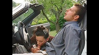 Amazing babe blows his thick dick in the car