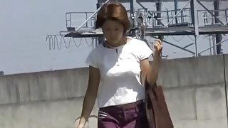 Hot Asian milf gets a nasty skirt sharking on a sunny day.