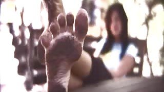 Chick stomping in dirty for foot fetish fans