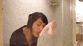 Girl plays with her dildo in the shower