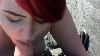 Cute redhead teen delivers a hot POV blowjob in the outdoors