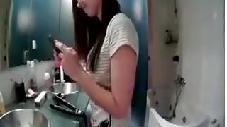 immature hottie strips in the bathroom