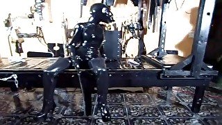 Extreme bondage for latex fetish slut