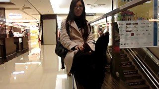 Attractive Asian Sophisticated Woman Exposes Her Lovely Feet At The Shopping Mall