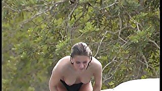 Lovely tanned girls on the swimming pool