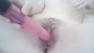 Horny slut masturbates hairy pussy by dildo