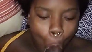 Young ebony enjoying a throat massage