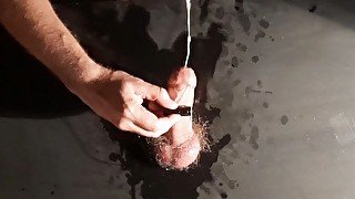 The guy made a homemade glory hole and came powerfully from a strong orgasm