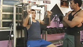 Sporty gay couple cum on each other at the gym after workout