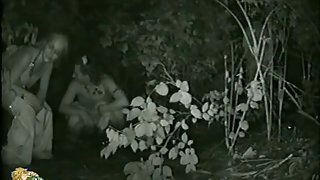 Piss porno filmed outside in a spot with low growing vegetation