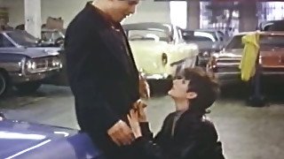 Raunchy brunette gal gives blowjob to car dealer at his workplace