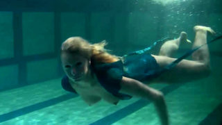 Blonde Feher with big firm tits underwater