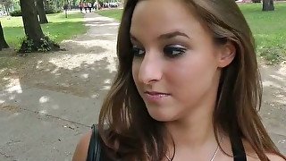 Alluring brunette girl gives awesome blowjob in public park