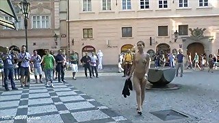 Naked young lady on a busy public street