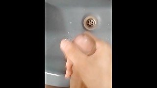 Jerking off in the bathroom with powerful cumshot at the end of the video