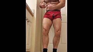 Hairy muscle bear flexing in red boxer briefs