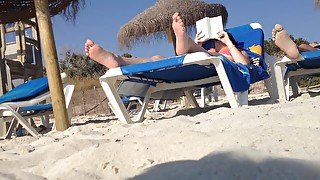 Brunette's candid feet at the beach