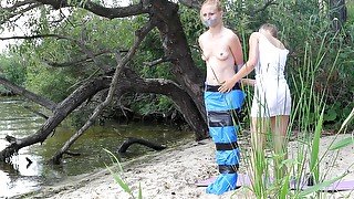 Girl Tied And Gagged In Trashbags On The Beach