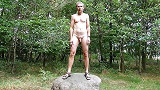 Nude posing on rock