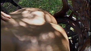 Hot busty African chic gets fucked from behind under a tree