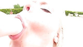 Sexy blonde in fishnet masturbating outdoors