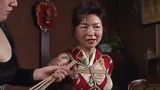 Asian mature bitch has a rope session to endure