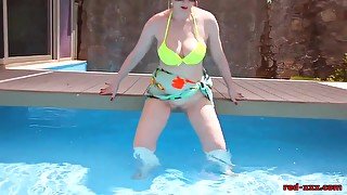 Mature redhead Red XXX fingering herself in the pool