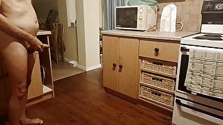 Sexy guy pissing all over the kitchen floor and making a big puddle