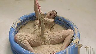 Kymberly Jane - Kym pleasures herself in a pool of oatmeal.