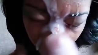 Ebony chick gets an ample cumshot to her forehead and nose