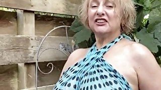 Hot mature blonde teases with her huge tits outdoors
