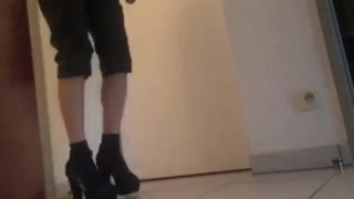 Teen boy wearing high heels