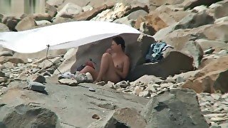 NUDIST COUPLES ON BEACH