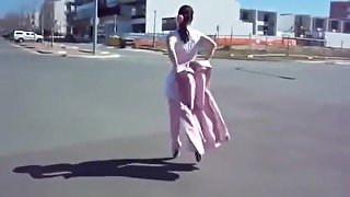 L.ady in Pink Ballet Boots walking outdoors