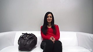 Delightful brunette with medium tits is kneeling on the floor and sucking her partners hard cock