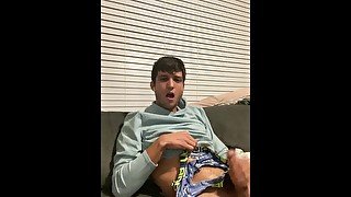 Hot stud jerks off on couch