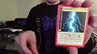 Cute Nerd Opening a Pack of Cards