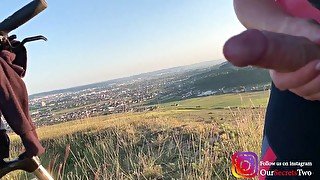 She jerks him on a public hiking trail near many houses - risky public handjob