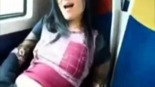 Asian milf rubs her clit on a train.