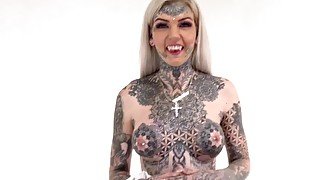 Inked up Australian babe with huge tits rides a vibrating sex toy